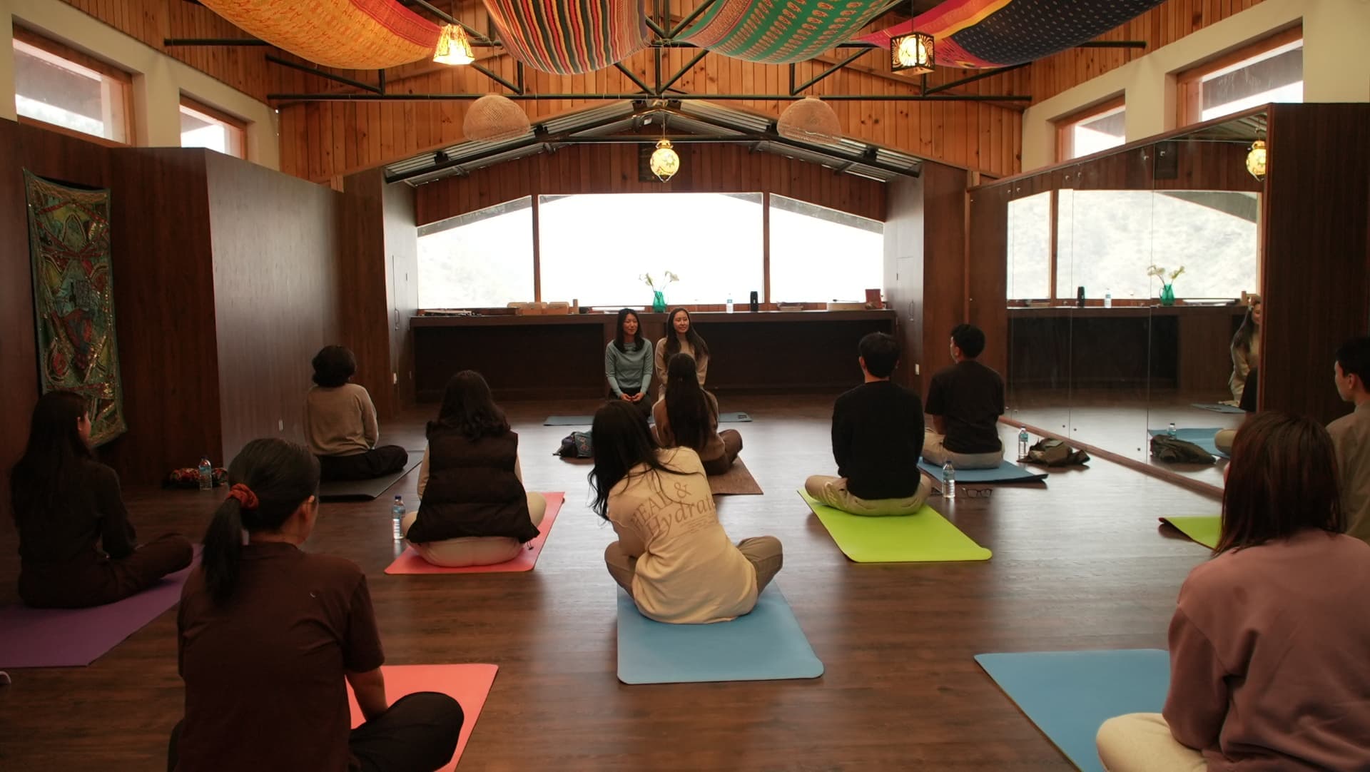 Participants gathered in a circle at the start of class